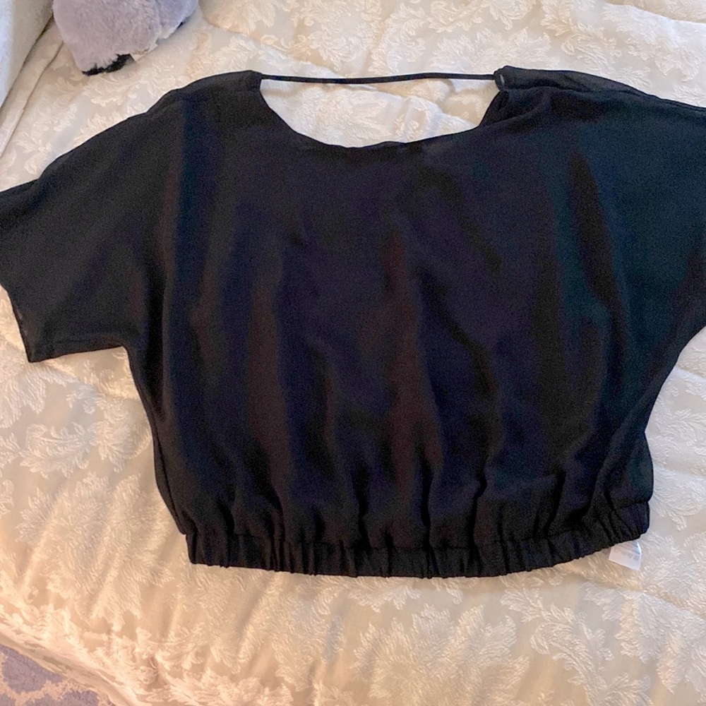 Beautiful semi see through longer cropped top.